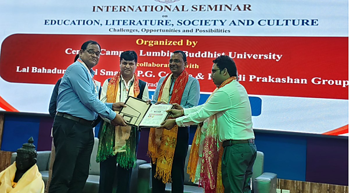 Certificate and memento presentation on stage at a Topic Engine-hosted seminar